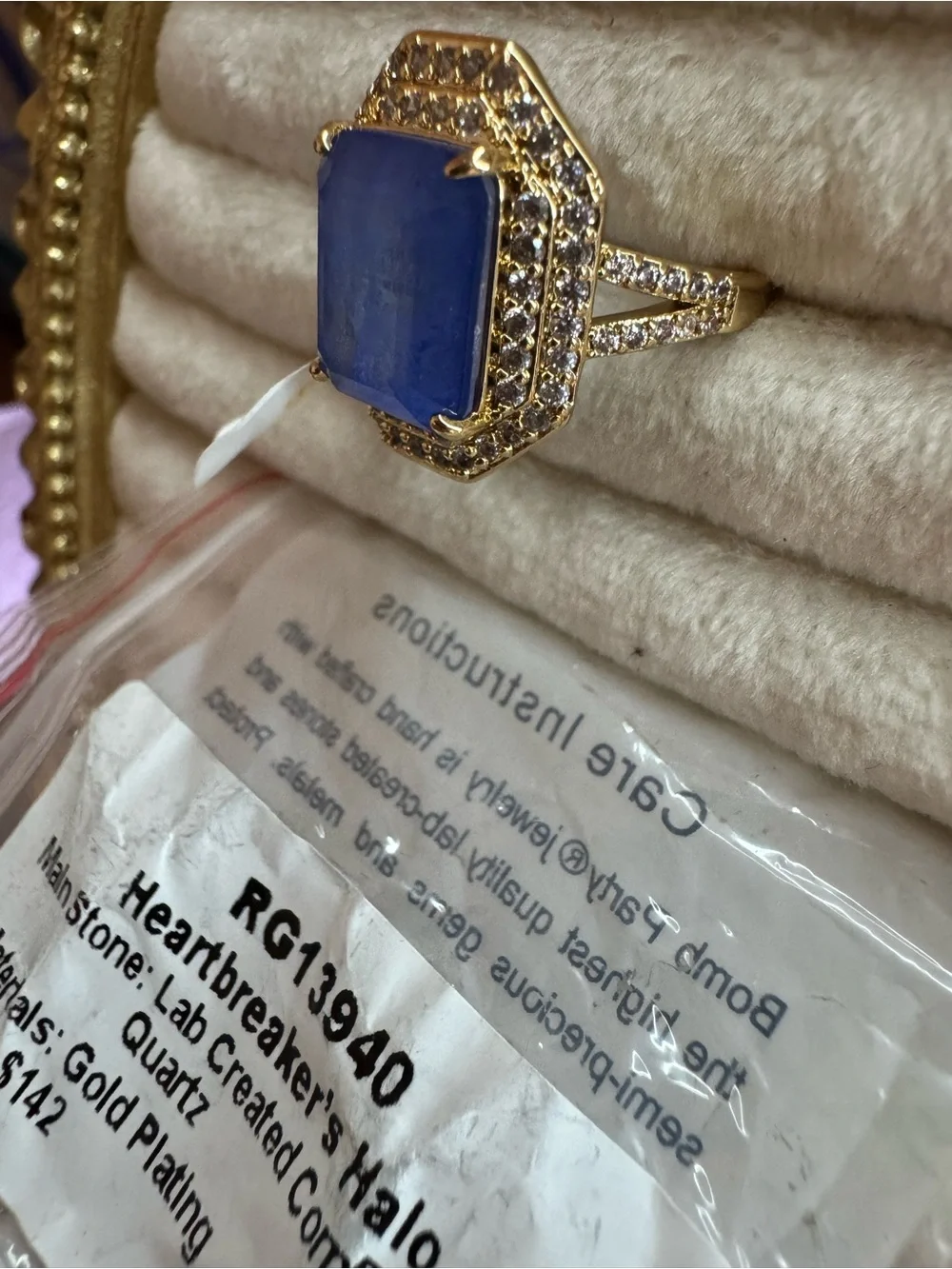 Heartbreaker’s Halo Gold Cocktail Ring with Deep Blue Center Stone